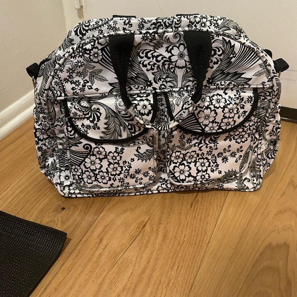 Oilcloth Alley travel bag. Has multiple zippers and pockets. - Picture 1 of 2